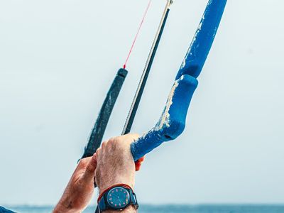 Close up of a man's hands gripping a bar